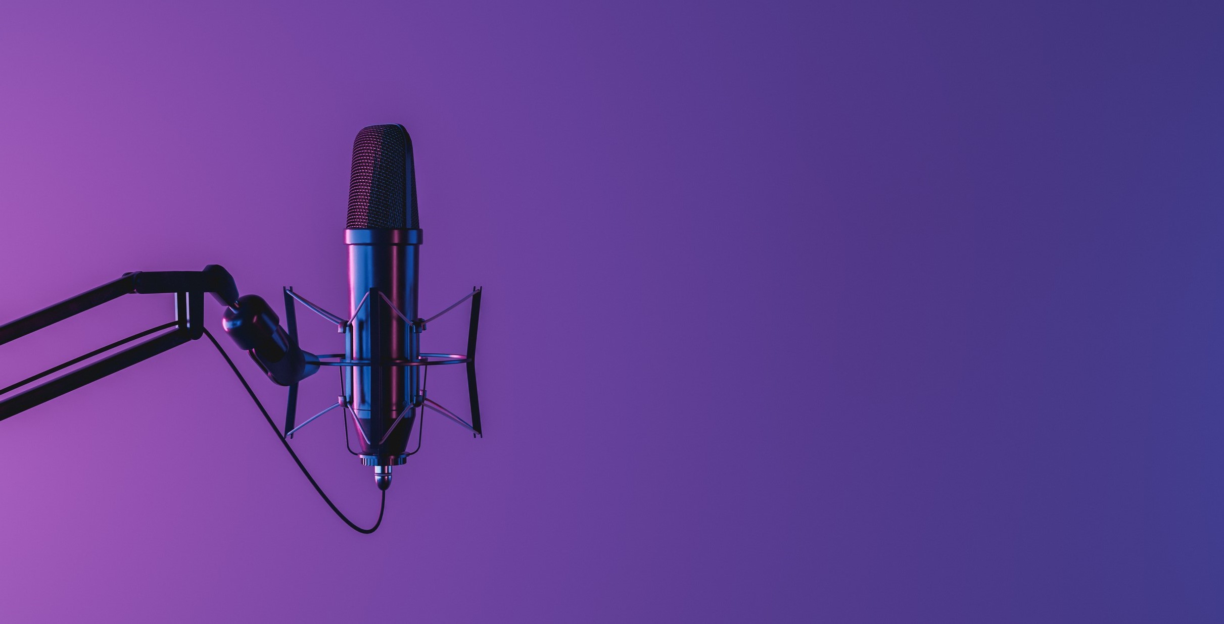 black microphone in front of purple background