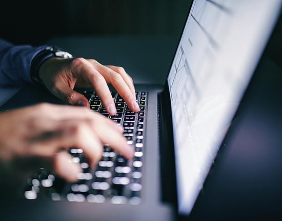Practice_Privacy Person typing on laptop